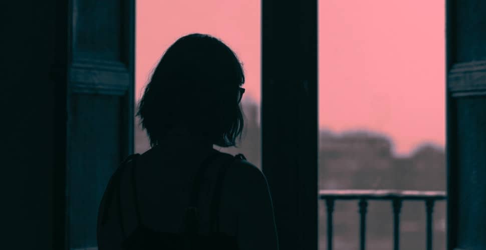 Woman looking out of window