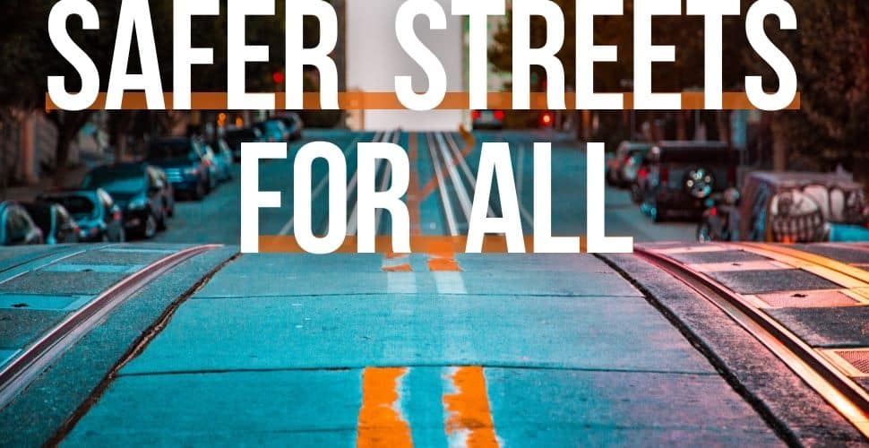 Safer Streets For All white text on street background