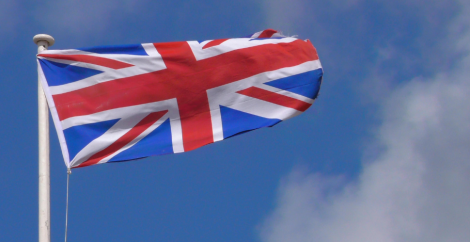 UK flag flying against blue sky