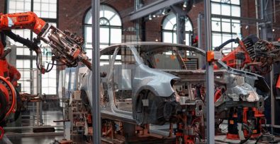 Car being assembled by robots