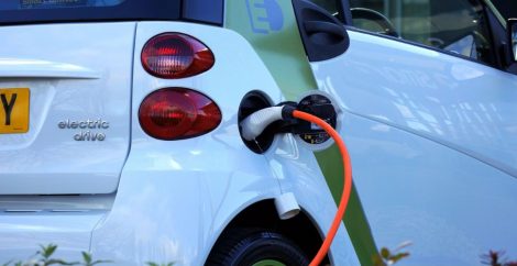 Image showing rear corner of a vehicle plugged in to charge