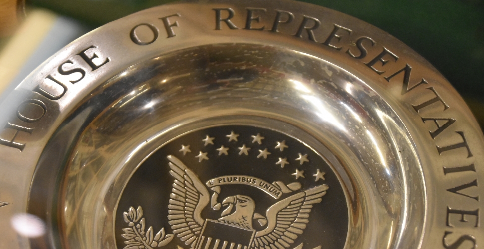 House of Representatives engraved in metal with logo in the middle
