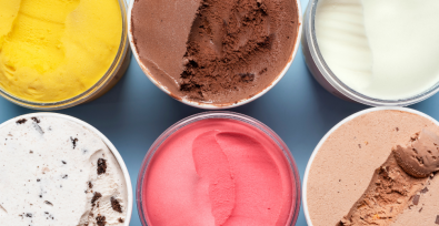 photo showing six different flavors of ice cream in containers