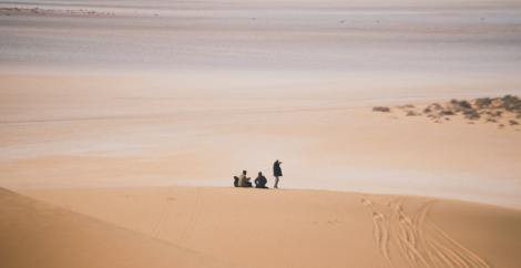 Four people in the middle of the desert