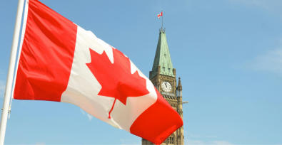 Canada flag waving in front of parliament