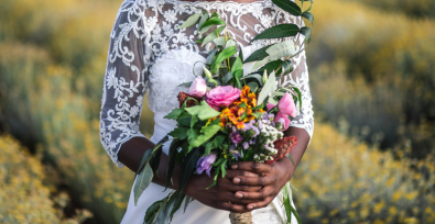 bride holding bouquet, representing forced marriage