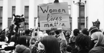 Protestor holding up a women lives matter sign