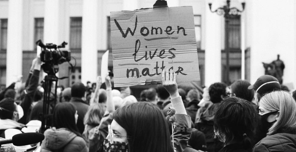 Protestor holding up a women lives matter sign