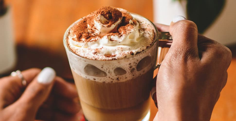 holiday drink with whipped cream and cinnamon