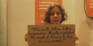 Woman holding sign